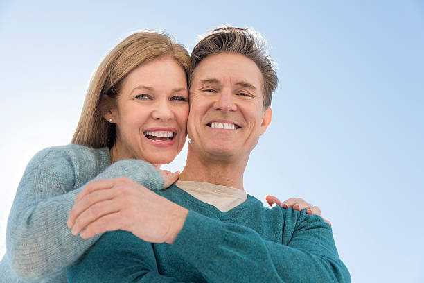 istock Low angle view of couple against clear sky 469764260
