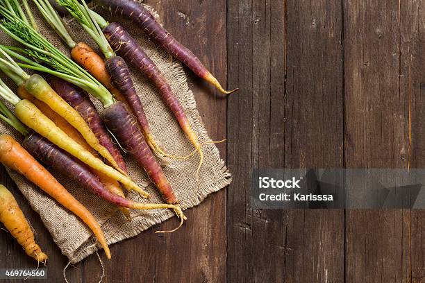 Fresh Organic Rainbow Carrots Placed On A Wood Table Stock Photo - Download Image Now