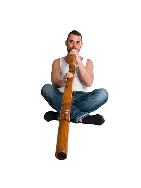 young caucasian man play music on his didgeridoo young caucasian man play music on his didgeridoo (Australian national musical instrument) temple newsam stock pictures, royalty-free photos & images