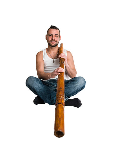 young caucasian man play music on his didgeridoo young caucasian man play music on his didgeridoo (Australian national musical instrument) temple newsam stock pictures, royalty-free photos & images