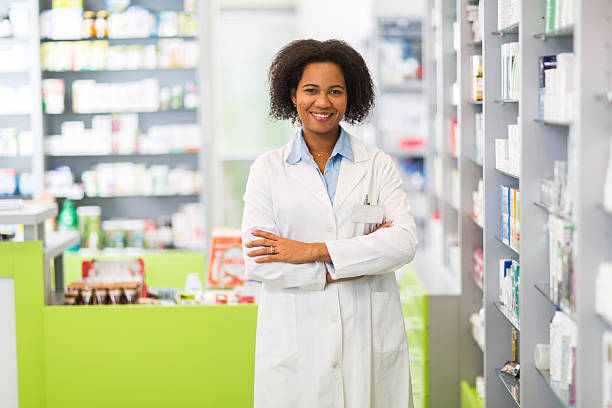 istock Smiling African American pharmacist standing in pharmacy. 469769314