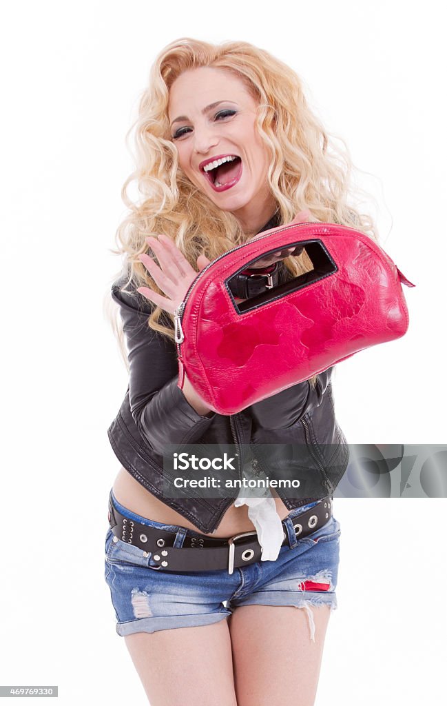 Beautiful blonde woman Beautiful blonde woman in nice clothes posing in the studio 2015 Stock Photo