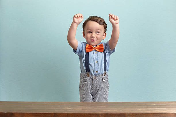 istock Happy and successful little boy with his hands up 469769512