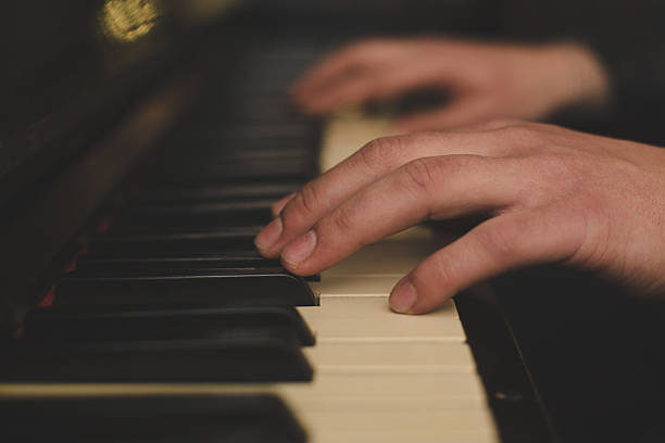 istock Hands playing the piano (close-up) with oldschool vintage instagram filter 469772396