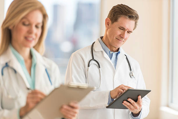 istock Male doctor using digital tablet at hospital 469772558