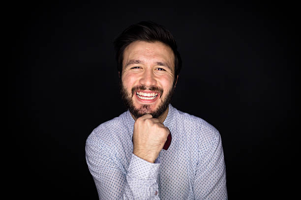 istock Portrait of young man laughing 469772566