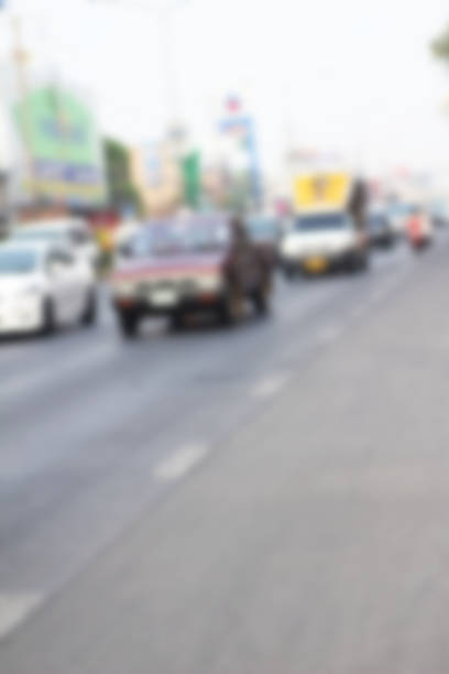 istock blurred of car on road 469773548