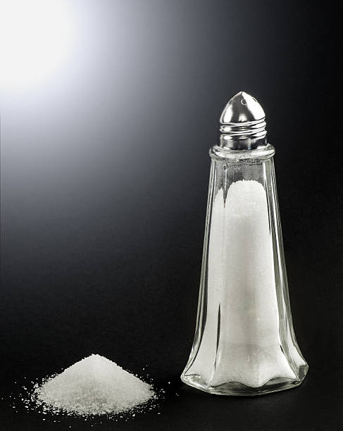 istock Salt shaker with a pie of salt alongside 469773598