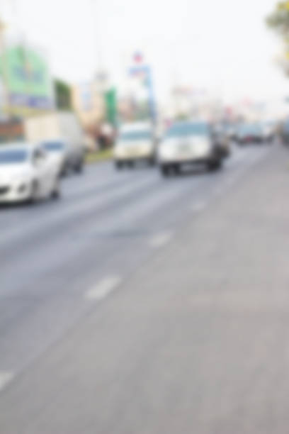 istock blurred of car on road 469773828
