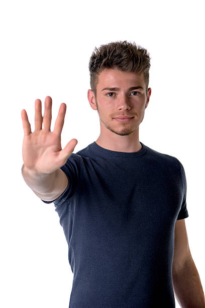 istock Handsome, seerious young man doing stop sign with his hand 469776610