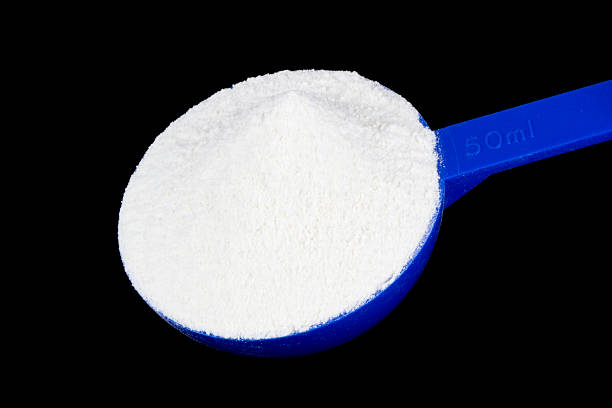 istock Protein powder isolated on black 469776924