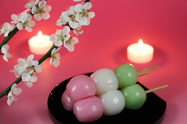 istock Japanese dumpling with Ume (Japanese plum) blossoms and candles 469776942