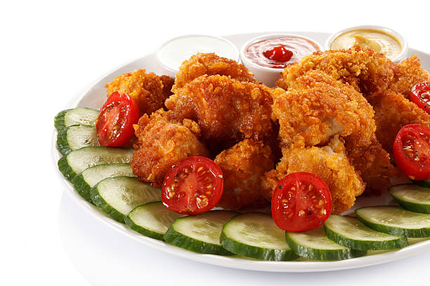 istock Chicken nuggets and vegetables 469777472
