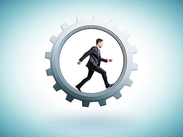istock businessman runs in gear 469778162