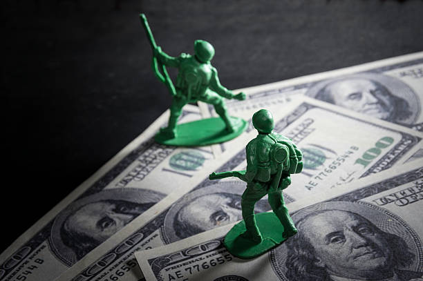 istock Soldier toys on money. 469778886