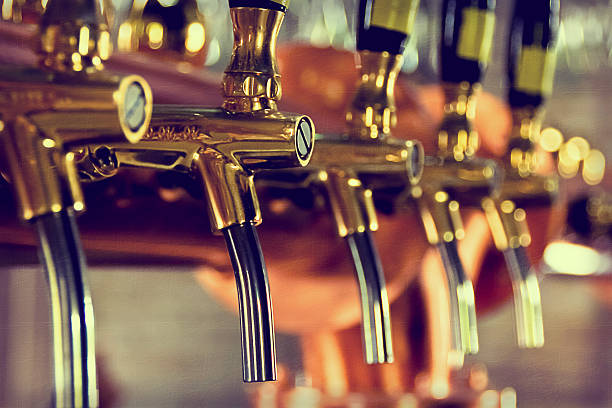 istock Beer taps at a bar with golden bars 469779270