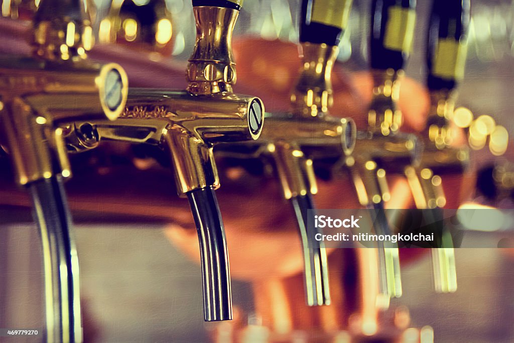 Beer taps at a bar with golden bars Beer tap Brewery Stock Photo