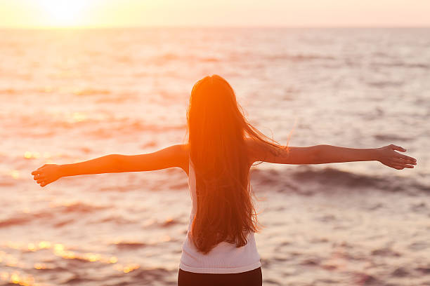 istock Beach woman laughing having fun 469782215