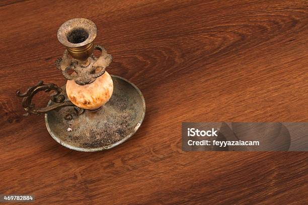 The Vintage Candlestick On The Wood Stock Photo - Download Image Now - 2015, Alloy, Antique