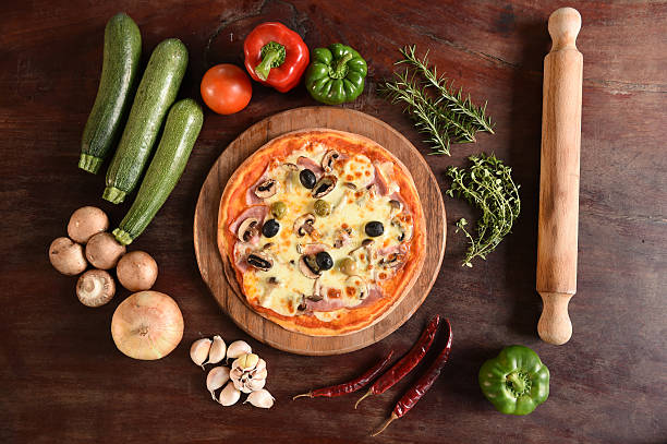 istock Pizza with ham, mushrooms and olives 469782970