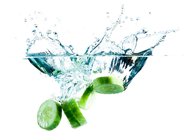 istock sliced cucumber splashing water isolated on white background 469783009