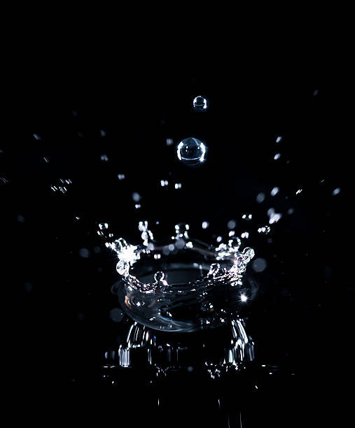 istock brilliant drops transparent water on black background 469784375
