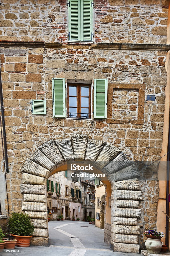 City of Sorano Narrow Alley with Old Buildings in the Italian City of Sorano Alley Stock Photo
