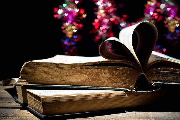 istock Pages of a book curved into a heart shape. 469785321