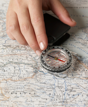 Close-Up of Using Compass on Map