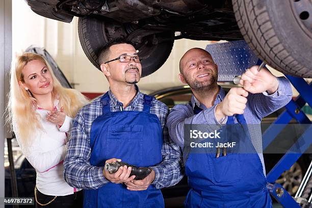 Service Crew And Driver Near Car Stock Photo - Download Image Now - 2015, 25-29 Years, 35-39 Years