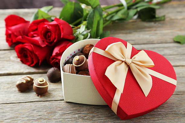 istock Beautiful heart gift box with chocolates on grey wooden backgrou 469787956