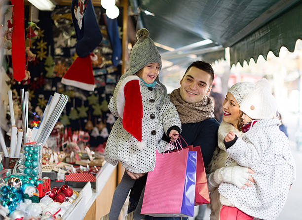 istock parents with kids at  X-mas market 469788308