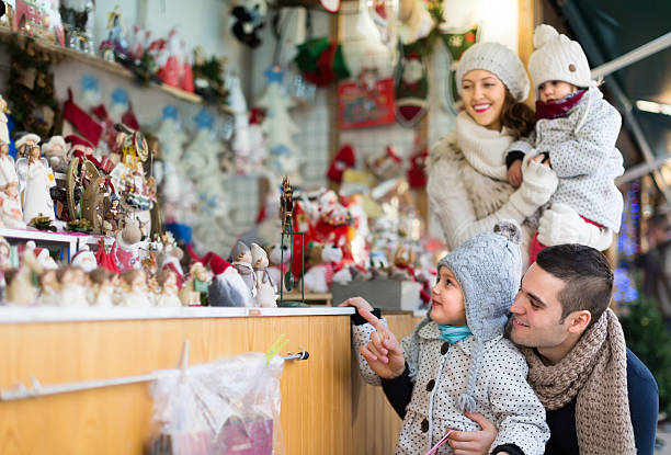 istock parents with kids at  X-mas market 469788314