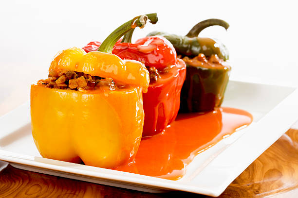 istock Bell peppers stuffed with mincemeat and sauce on plate 469788406