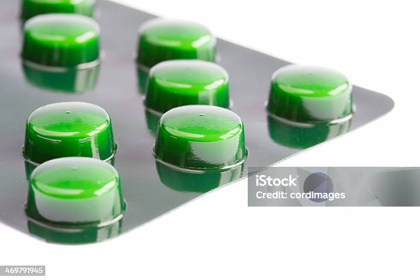 Green Pills In A Blister Pack On White Stock Photo - Download Image Now - Antibiotic, Blister, Excess