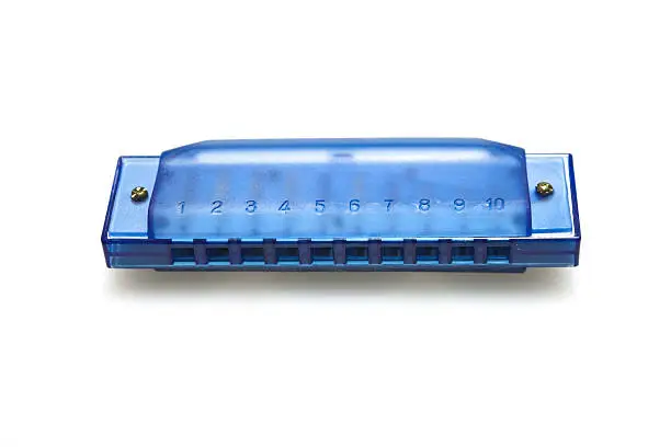 One blue harmonica on a white background