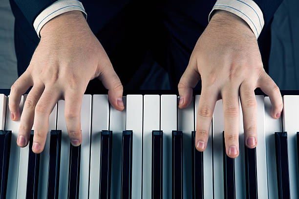 istock Piano keys and human hands 469793083