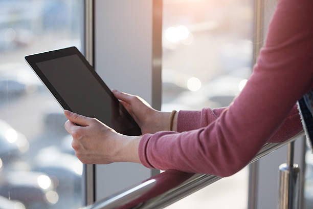 istock woman hand presses on screen digital tablet 469793384