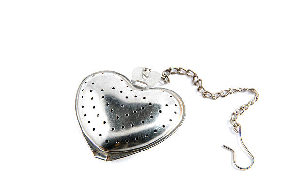 istock Dried tea in tea-strainer on white background 469793968