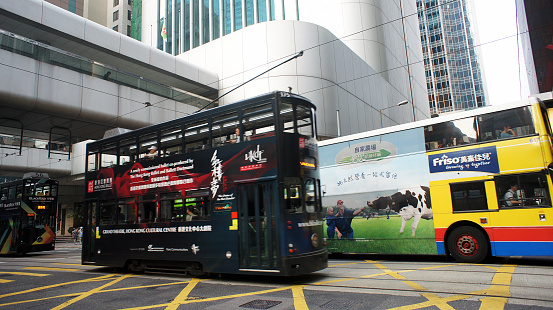 Hong Kong, China - October 12, 2013: Street Scene in Hong Kong. Hong Kong Double Decks Bus is the Famous transportation in Hong Kong. The Bus was introduce by the English as Double Decks bus also the most commonly transportation use in London.