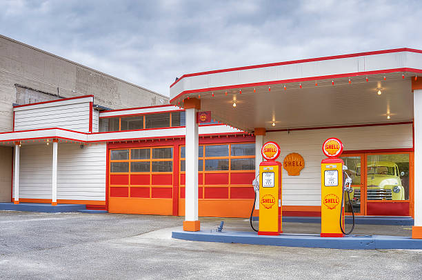 Monytreal, Canada - July 24, 2016: Shell gas station in Montreal Canada with ice box, propane and car wash. Customers are visible.