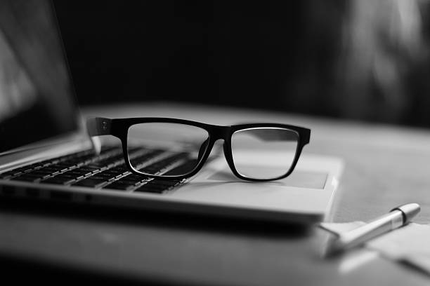 istock Laptop and Glasses in black & white 469795358