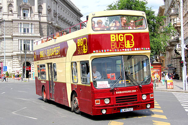 Alexander RH Budapest, Hungary - July 23, 2014: Brown city sightseeing bus Alexander RH drives at the city street. coach bus stock pictures, royalty-free photos & images