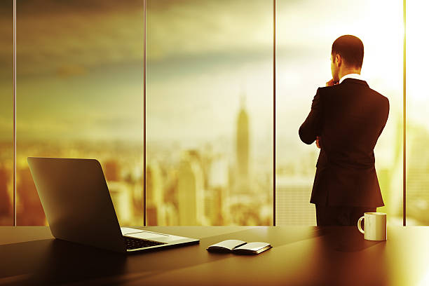 istock businessman standing in office 469798064