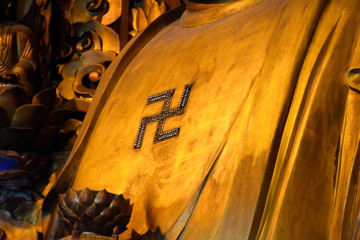 Golden Buddha statue in the old Longhua Temple, a Buddhist site dedicated to the Maitreya Buddha. It is the largest, most authentic and ancient temple complex in Shanghai.