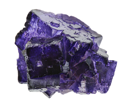 Purple fluorite crystals specimen isolated at white background