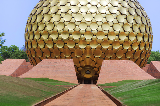 Auroville, India - April 1, 2015: Matrimandir - Golden Temple in Auroville. Matrimandir is an edifice of spiritual significance for practitioners of Integral yoga, situated at the centre of Auroville initiated by The Mother of the Sri Aurobindo Ashram