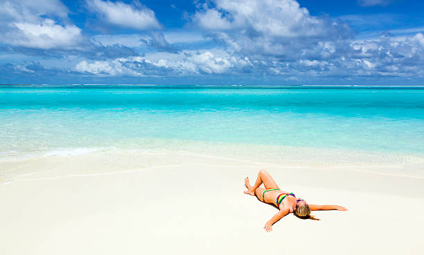 istock Woman lying on the maldivian coast line 469799601