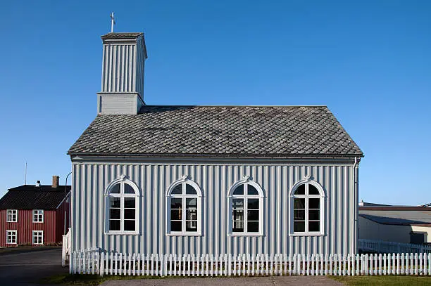 The western Iceland, the old Protestant Church of Stykkisholmur in front of a blue sky, in the north of the Snæfellsnes peninsula