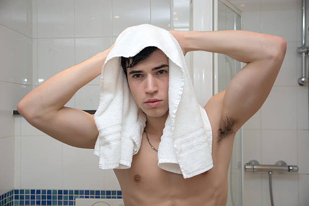 istock Attractive Young Bare Muscular Man after Taking Shower 469802606